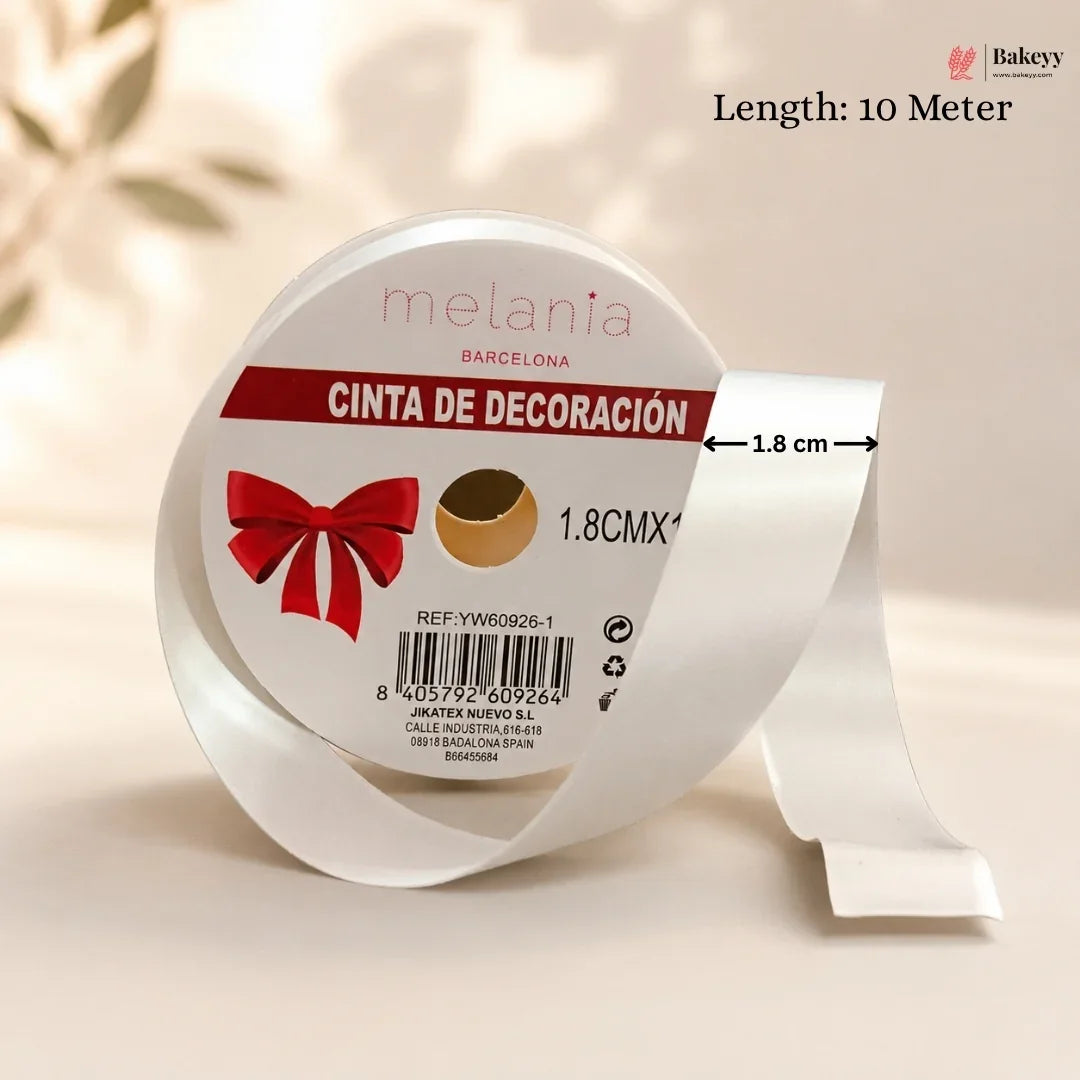 Roll of decorative ribbon with 'melania Barcelona' branding on a beige background