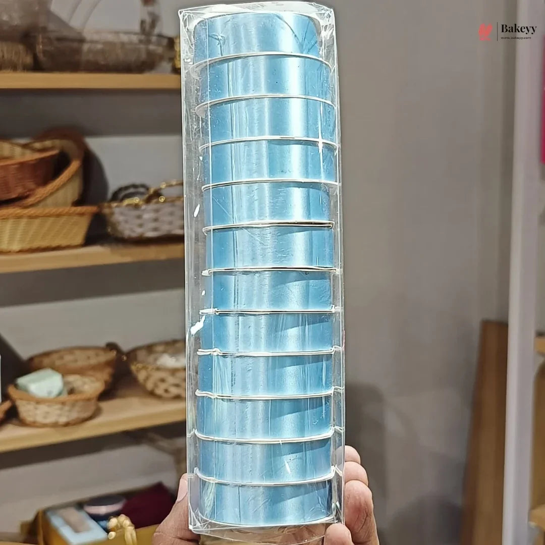 Packaged blue cake roll with a blurred kitchen background