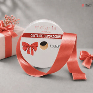 Red decorative ribbon with a packaging label on a gray background