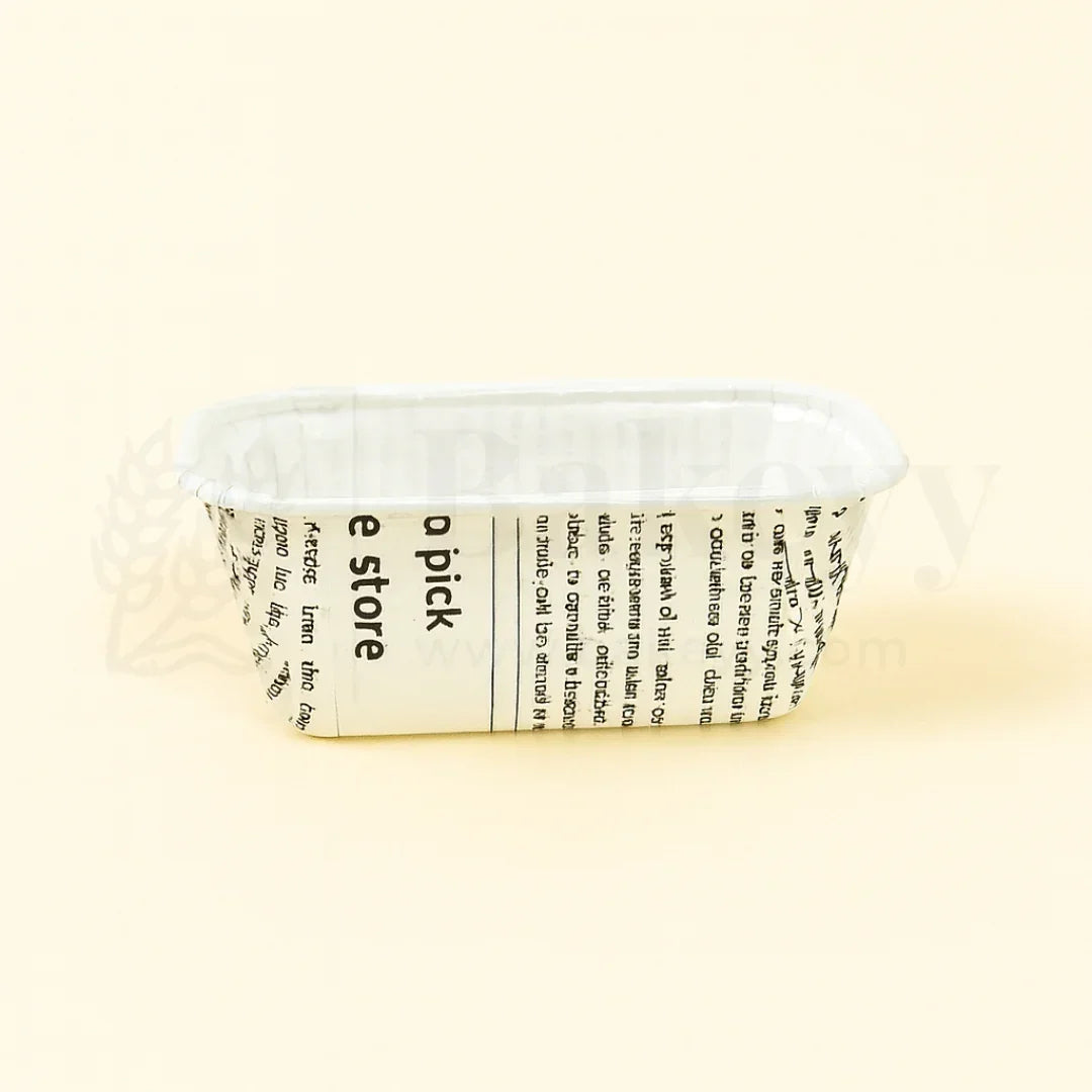 Clear plastic container with a white bar of soap and printed label on a beige background