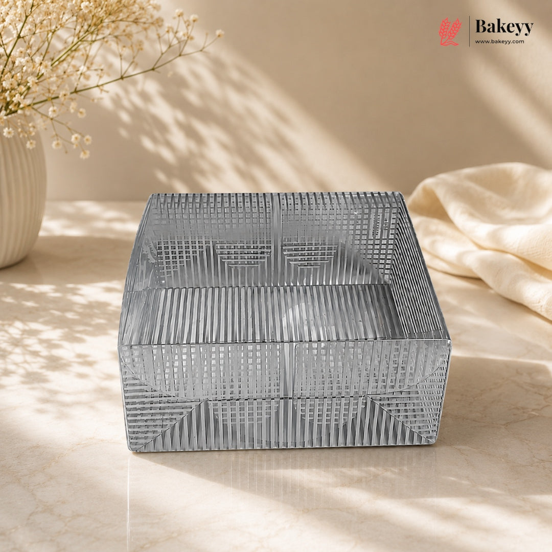 Decorative metal box with geometric pattern on a light surface, featuring the Bakeyy brand.