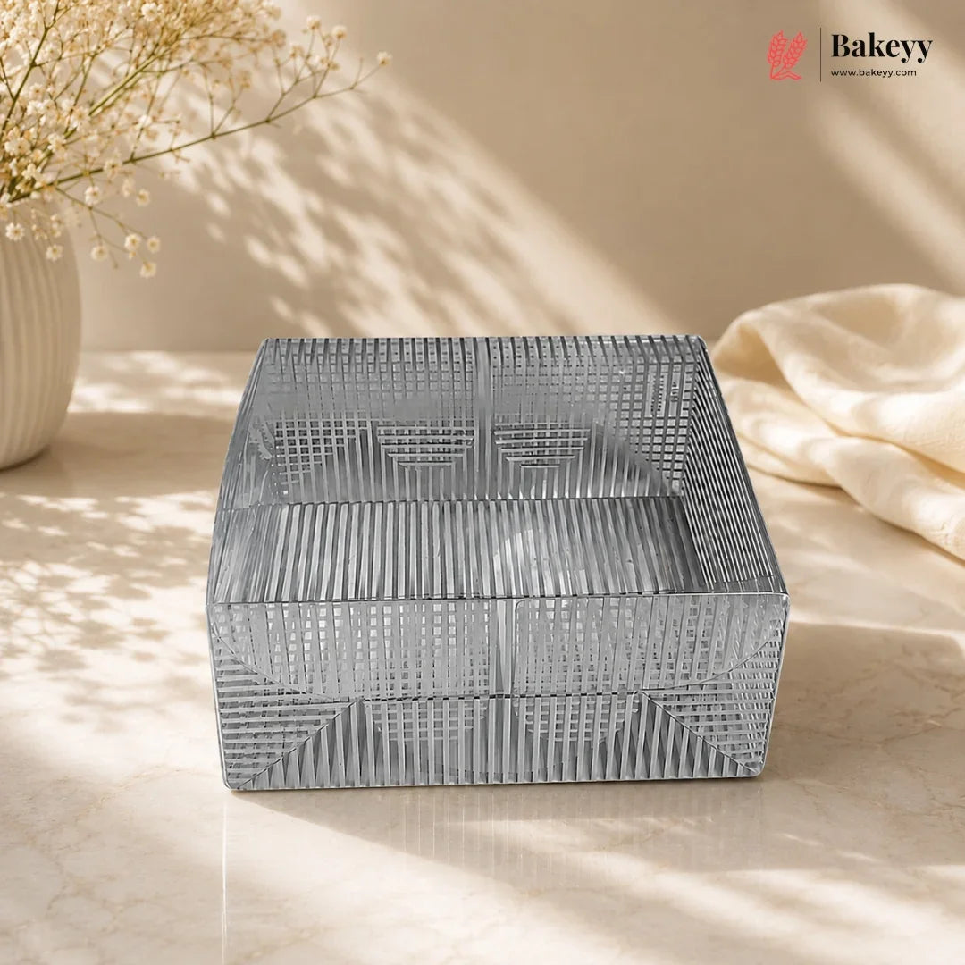 Decorative metal box with geometric pattern on a light surface, featuring the Bakeyy brand.