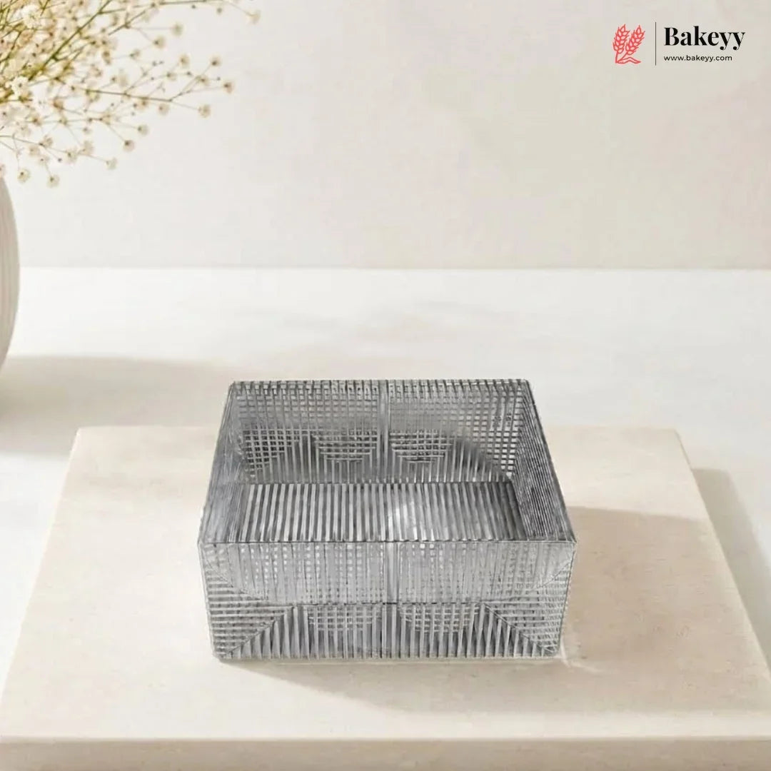 Metal wire basket on a white surface with 'Bakeyy' branding in the corner.