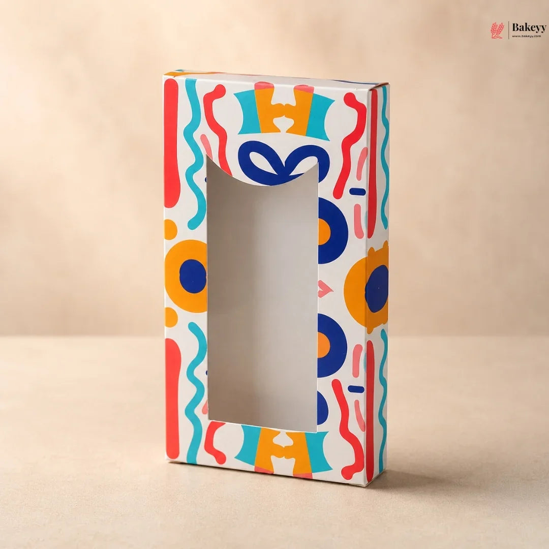 Colorful box with abstract patterns on a beige background