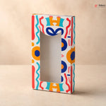 Colorful box with abstract patterns on a beige background