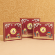 Three ornate greeting cards with floral and architectural designs on a beige background.