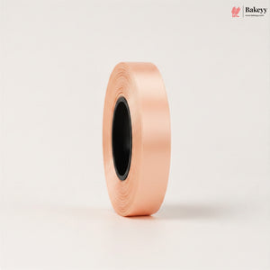 Roll of pink ribbon on a light beige background with 'Bakeyy' branding.
