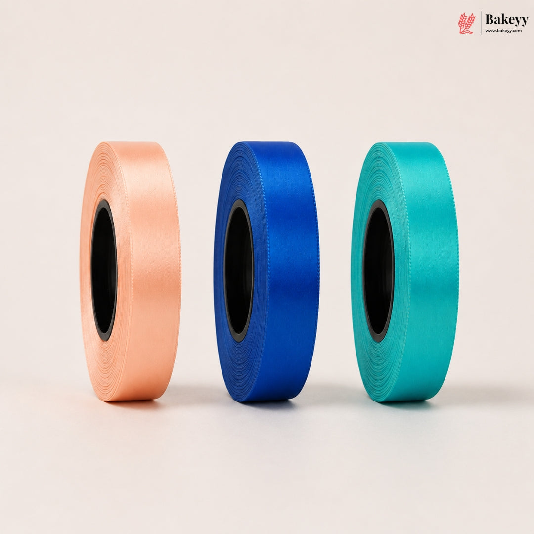 Three rolls of ribbon in peach, blue, and teal on a light beige background with 'Bakeyy' branding.