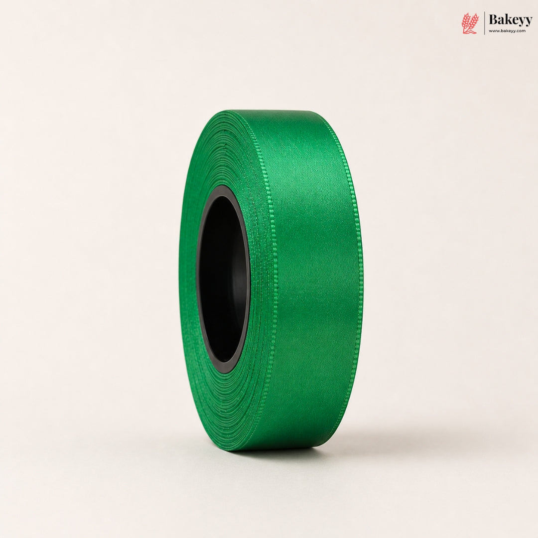Roll of green ribbon on a beige background with 'Bakeyy' branding.