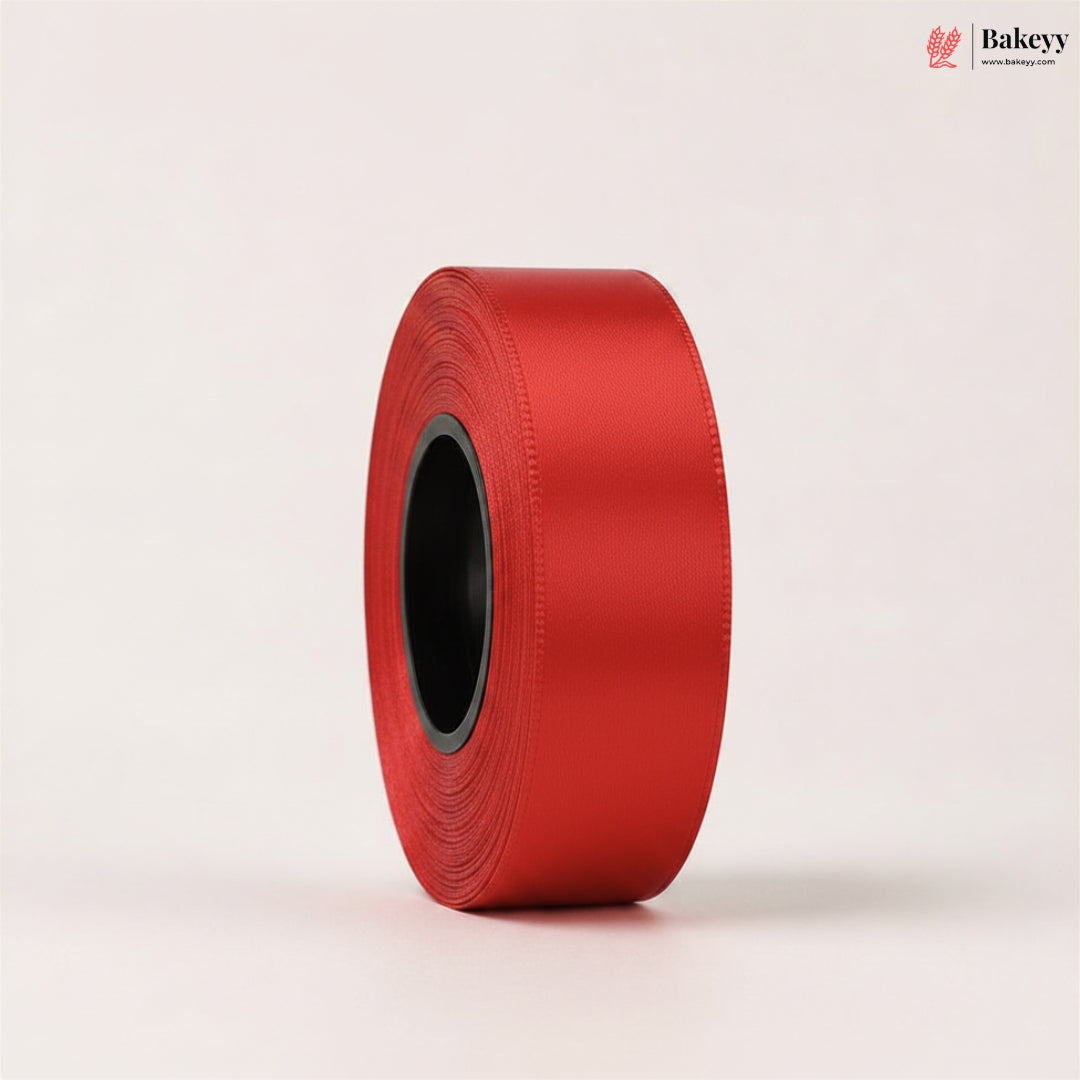 Roll of red ribbon on a light beige background with 'Bakeyy' branding.