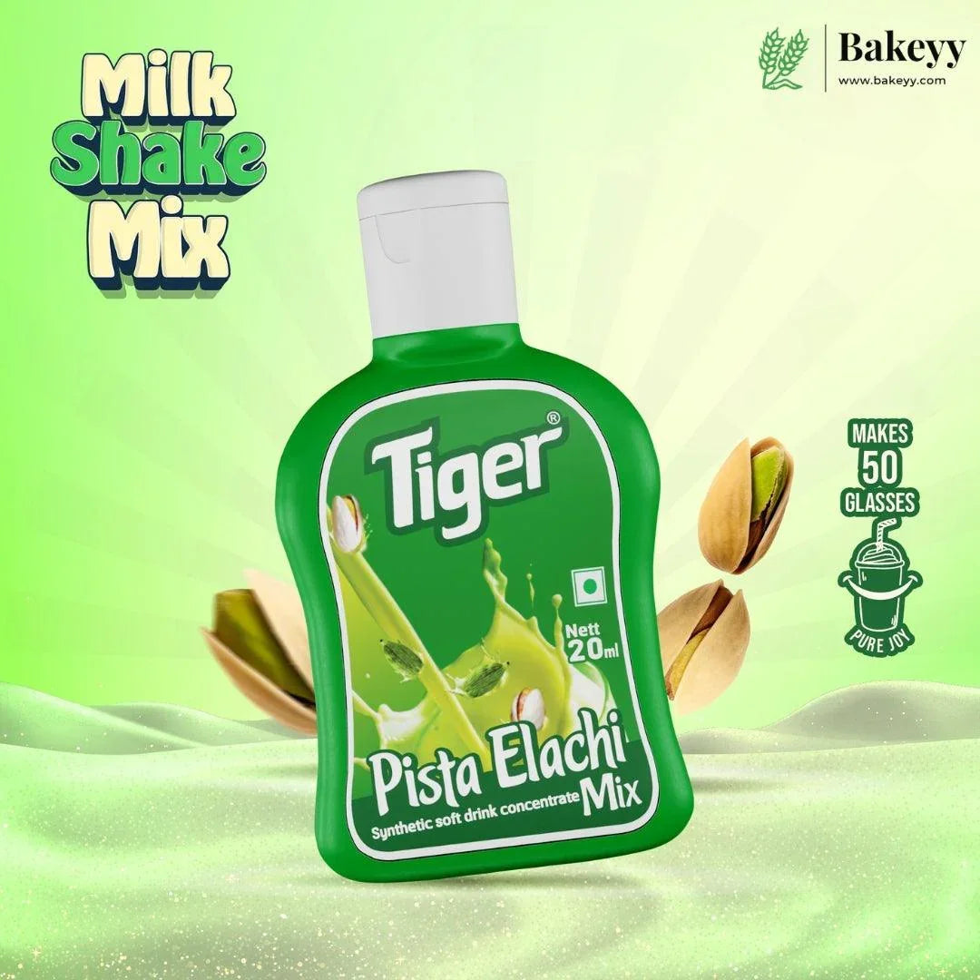 Green bottle of Tiger Pista Elachi Mix on a green background with 'Bakeyy' branding.