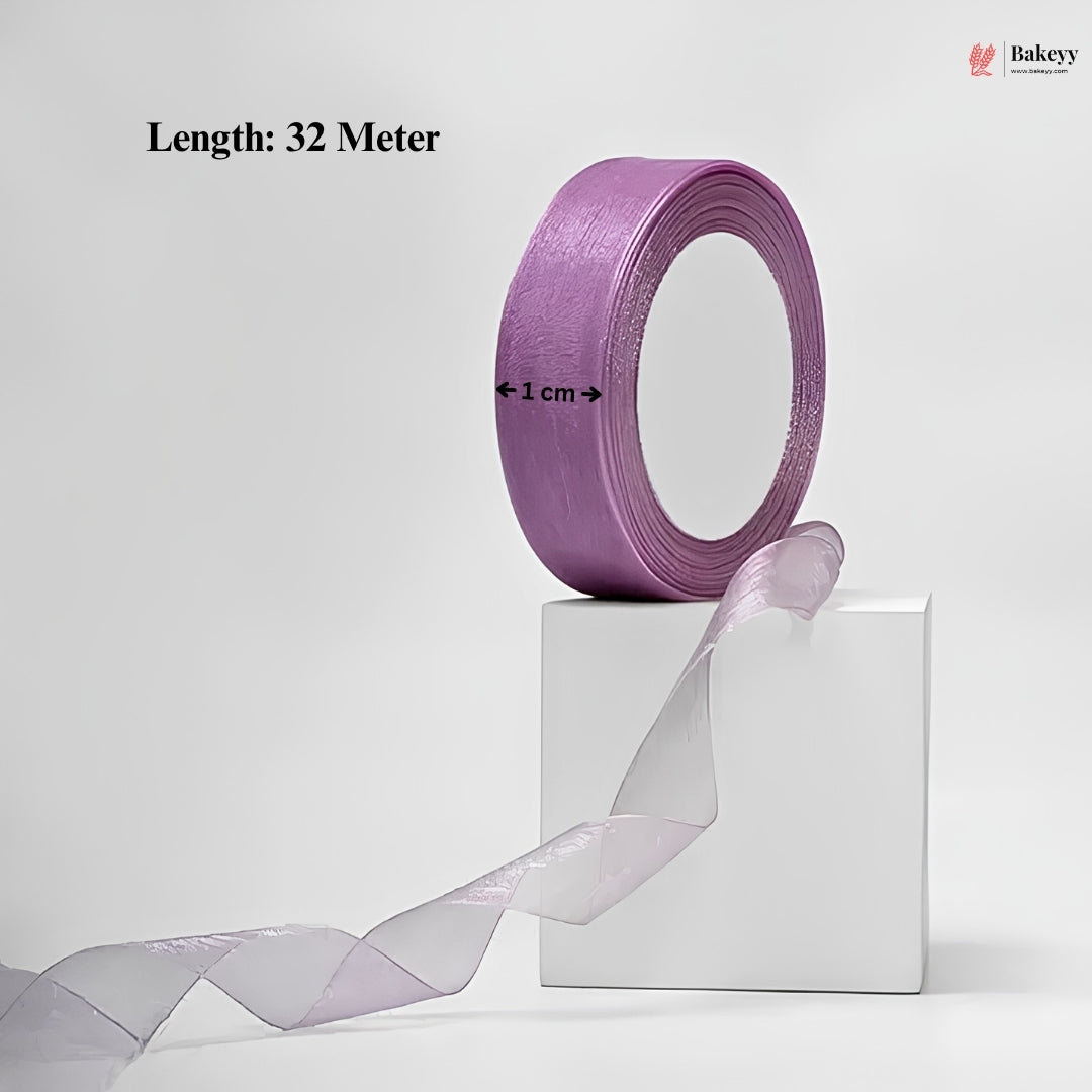 Roll of purple ribbon with a white box on a light gray background, featuring Bakeey branding.