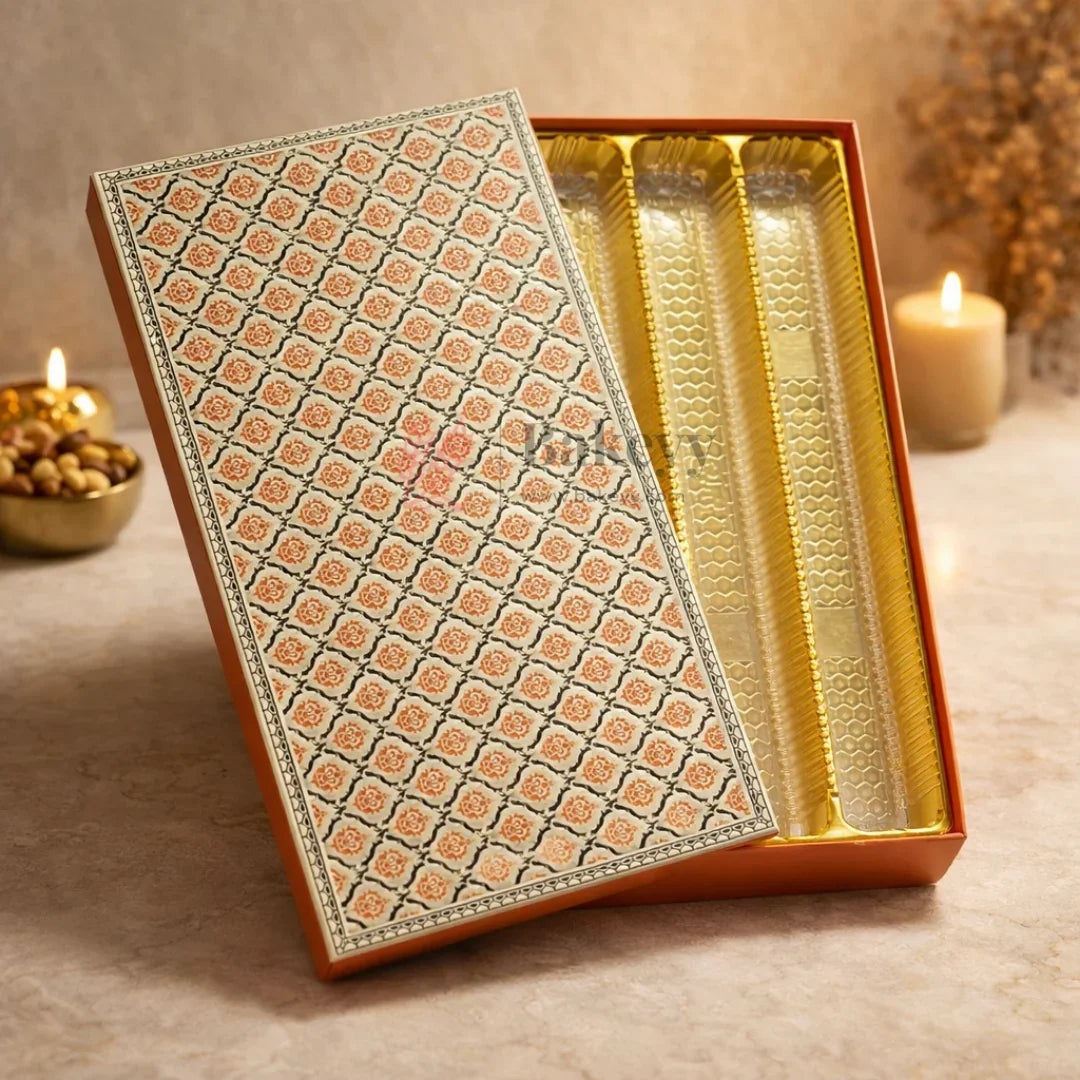 Capacity: Suitable for approx. 1 kg sweets or chocolates (depending on product type)
Premium rigid hardboard construction
Luxury floral printed lid design
Gold finish food-grade plastic inner tray
4 long compartments for organized arrangement
Ideal for Diwali, Weddings, Festive Hampers & Corporate Gifting