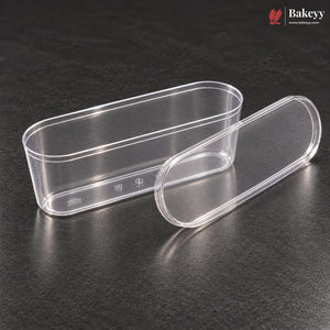 Two clear plastic oval containers, one rectangular with a lid and one rounded capsule-shaped with its lid, displayed on a dark textured surface. The Bakeey brand logo is visible in the top right corner.