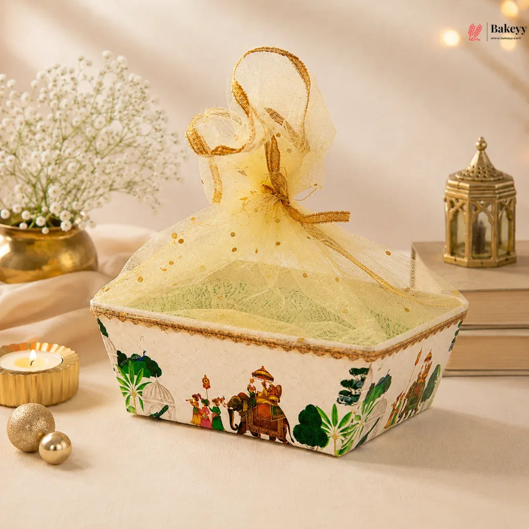 Decorative box with a sheer lid on a table with candles and flowers