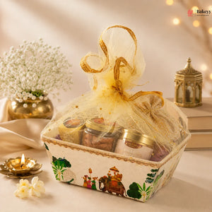 Decorative gift basket with jars and a gold ribbon on a soft background
