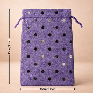 Purple drawstring bag with black and gold polka dots and measurements on a beige background