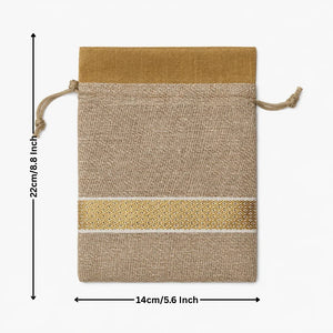 Natural fabric drawstring pouch with gold accents and measurements on a white background
