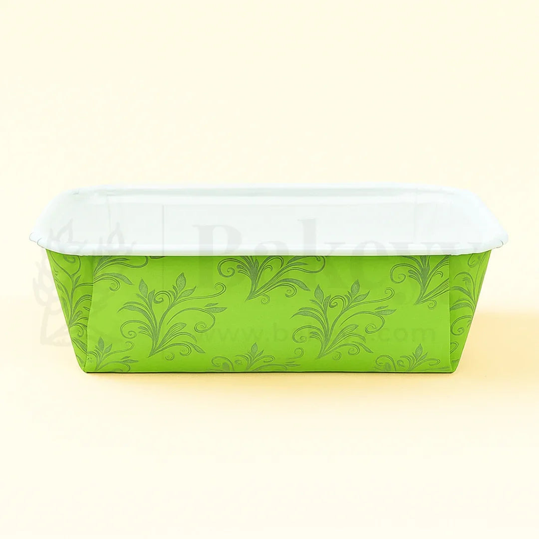 Green floral-patterned container with a white lid on a light yellow background