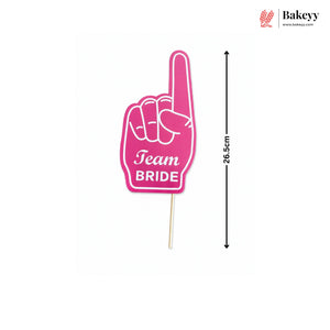 Pink foam finger with 'Team Bride' text on a white background, featuring the brand 'Bakeyy'.