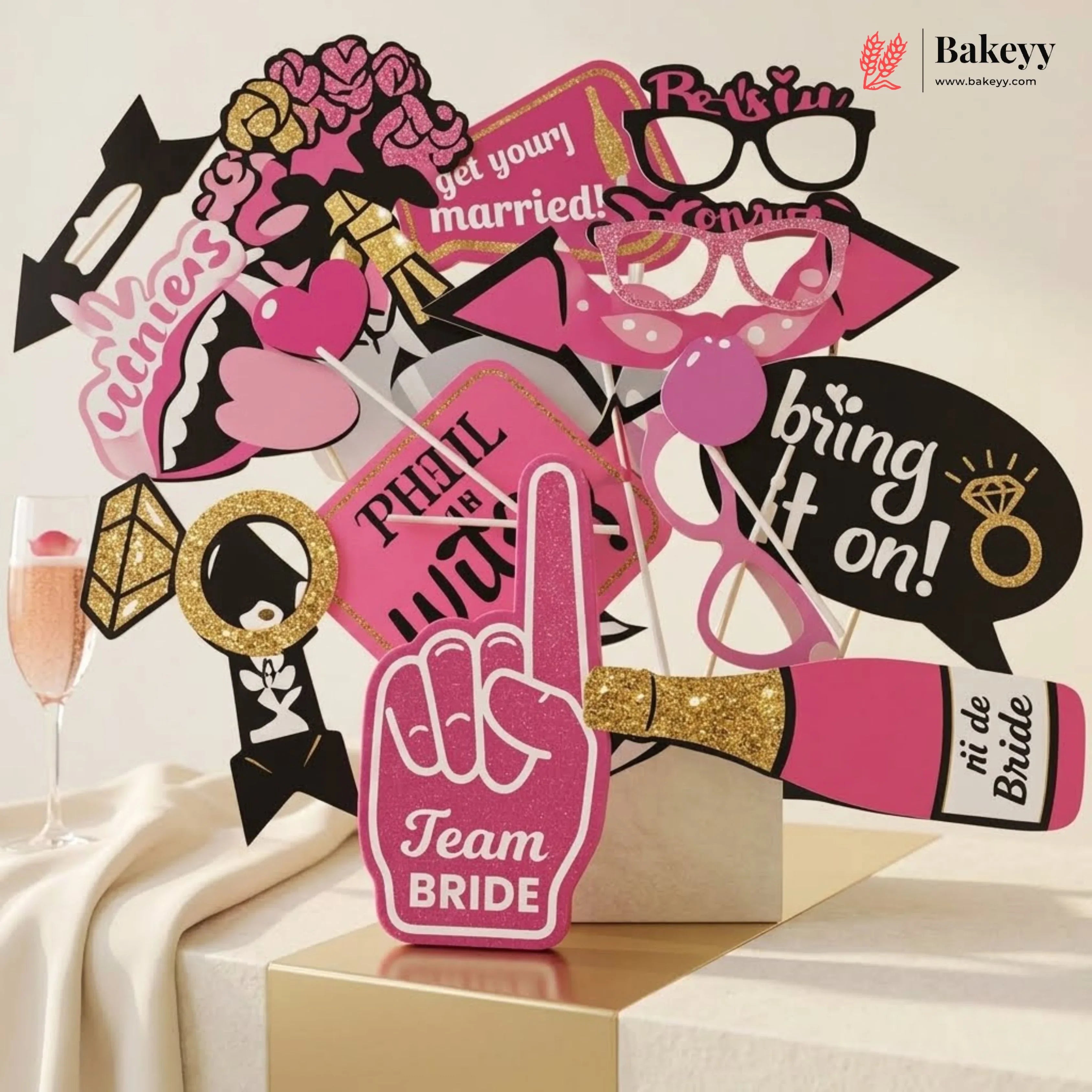 Collection of pink and black photo booth props with 'Team Bride' sign on a white background.