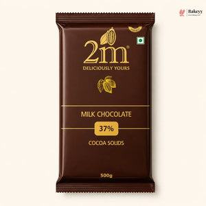 A 500g package of 2m Milk Chocolate 37% Cocoa Solids, shown against a light cream background. The packaging is dark brown with gold lettering and cocoa illustrations.