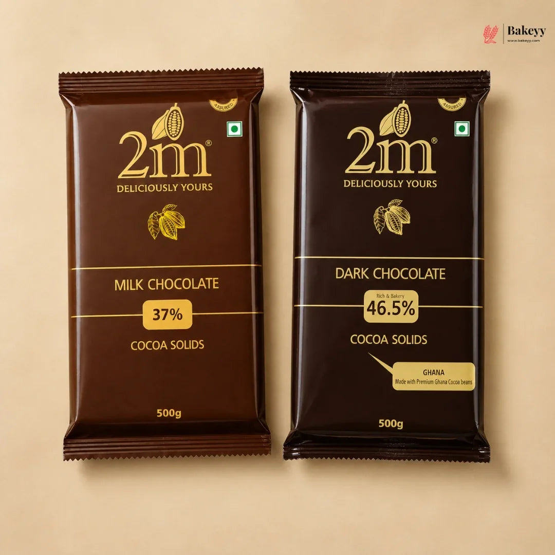Two 500g packages of 2m chocolate on a beige background, featuring Milk Chocolate 37% Cocoa Solids on the left and Dark Chocolate 46.5% Cocoa Solids on the right.