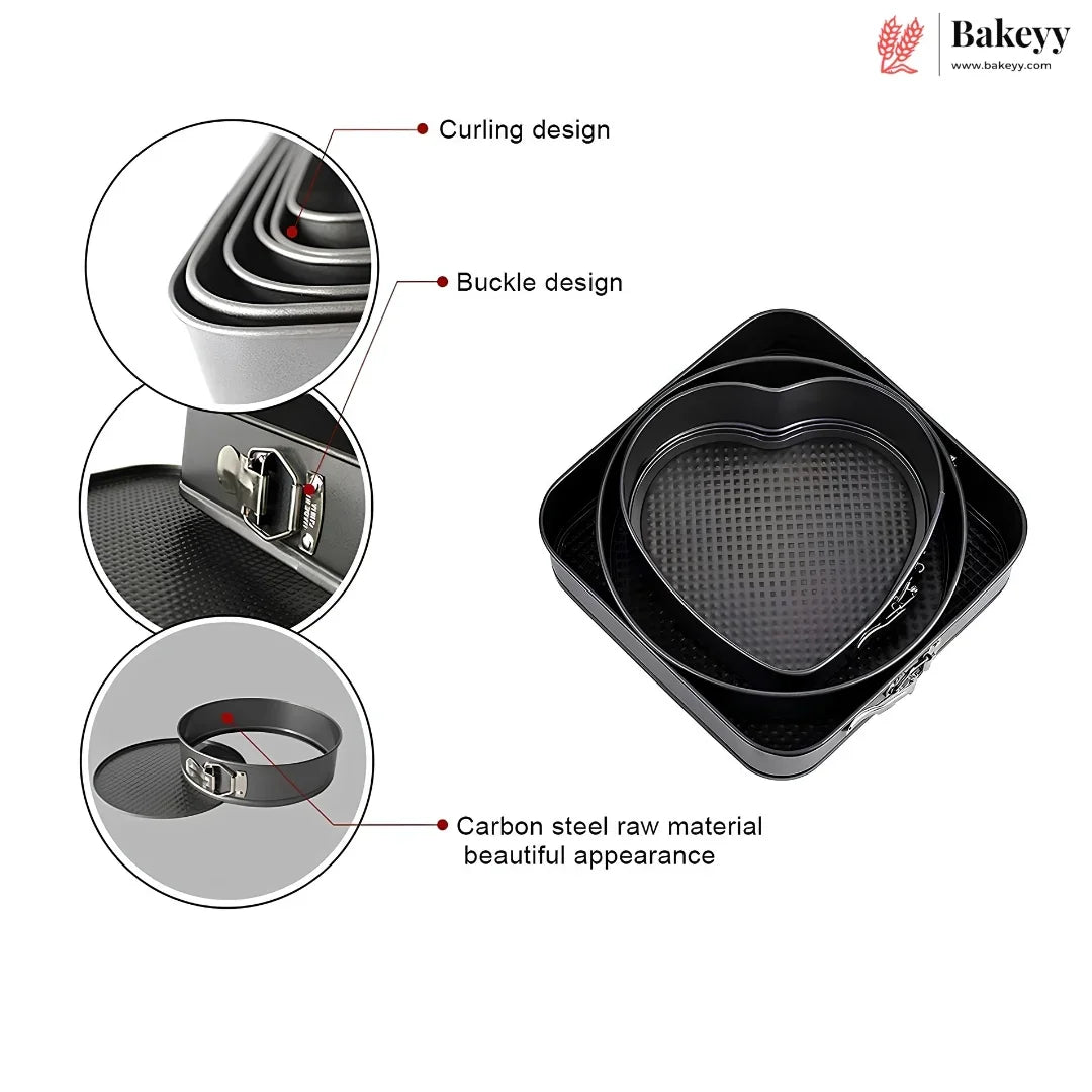 Black heart-shaped carbon steel springform cake pans shown with three circular detail callouts highlighting the curling design, buckle design, and raw material finish. The Bakeyy brand logo is visible in the top right corner.