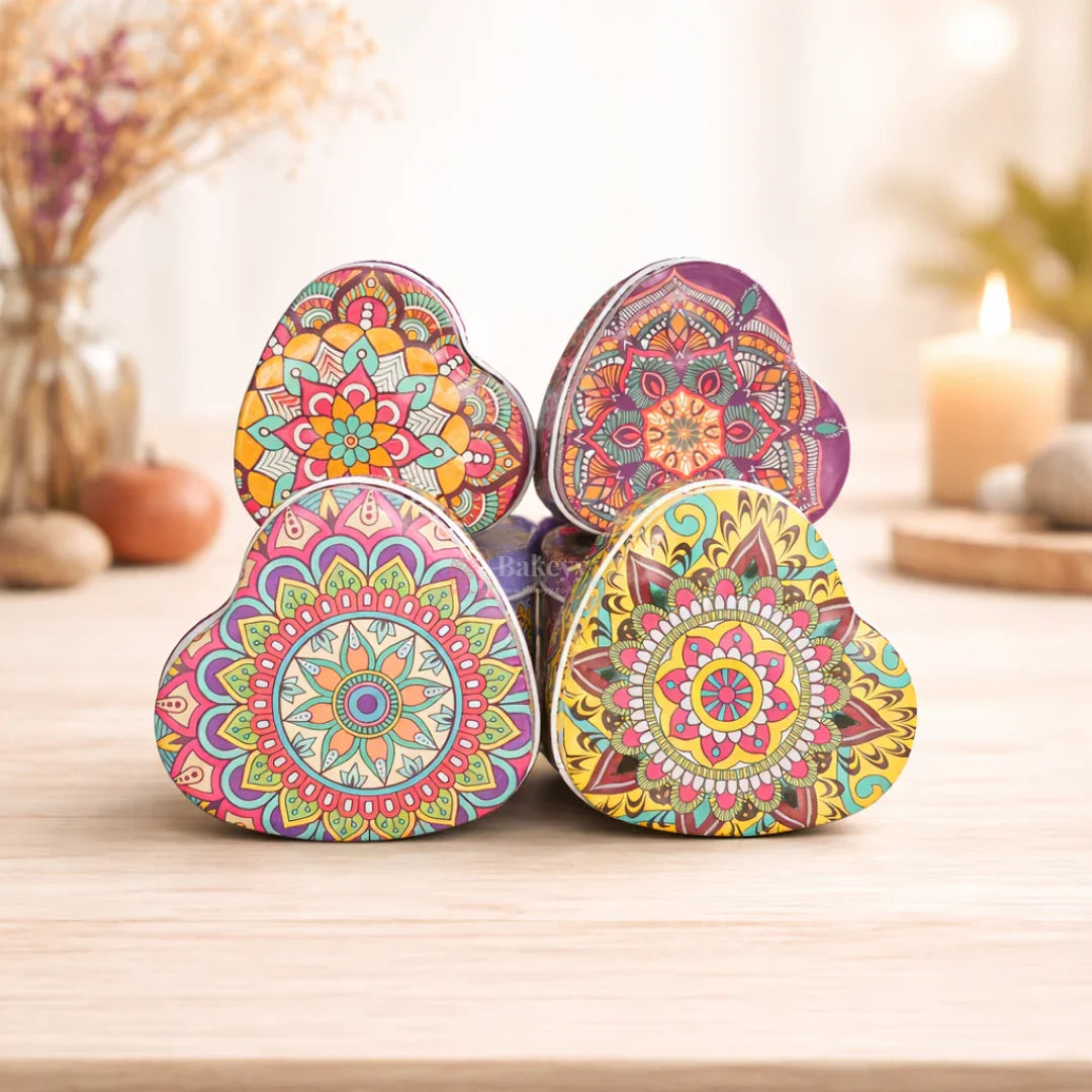 Colorful heart-shaped mandala gift boxes on wooden table, ideal for bakery packaging from Bakeyy.com