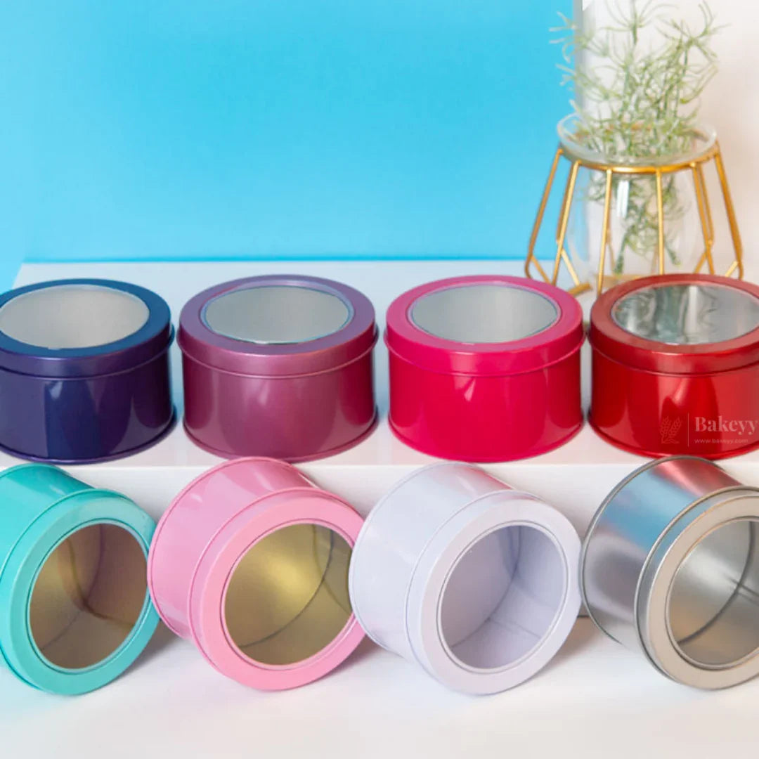 Colorful round tin containers for baking and gift packaging from Bakeyy.com on display
