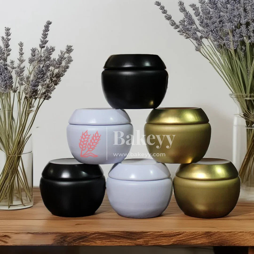 Stacked matte black, white, and gold round jars for baking supplies, Bakeyy.com branding