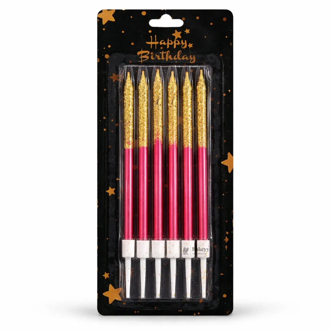 Bakeyy pack of six gold and pink birthday cake candles in festive star packaging