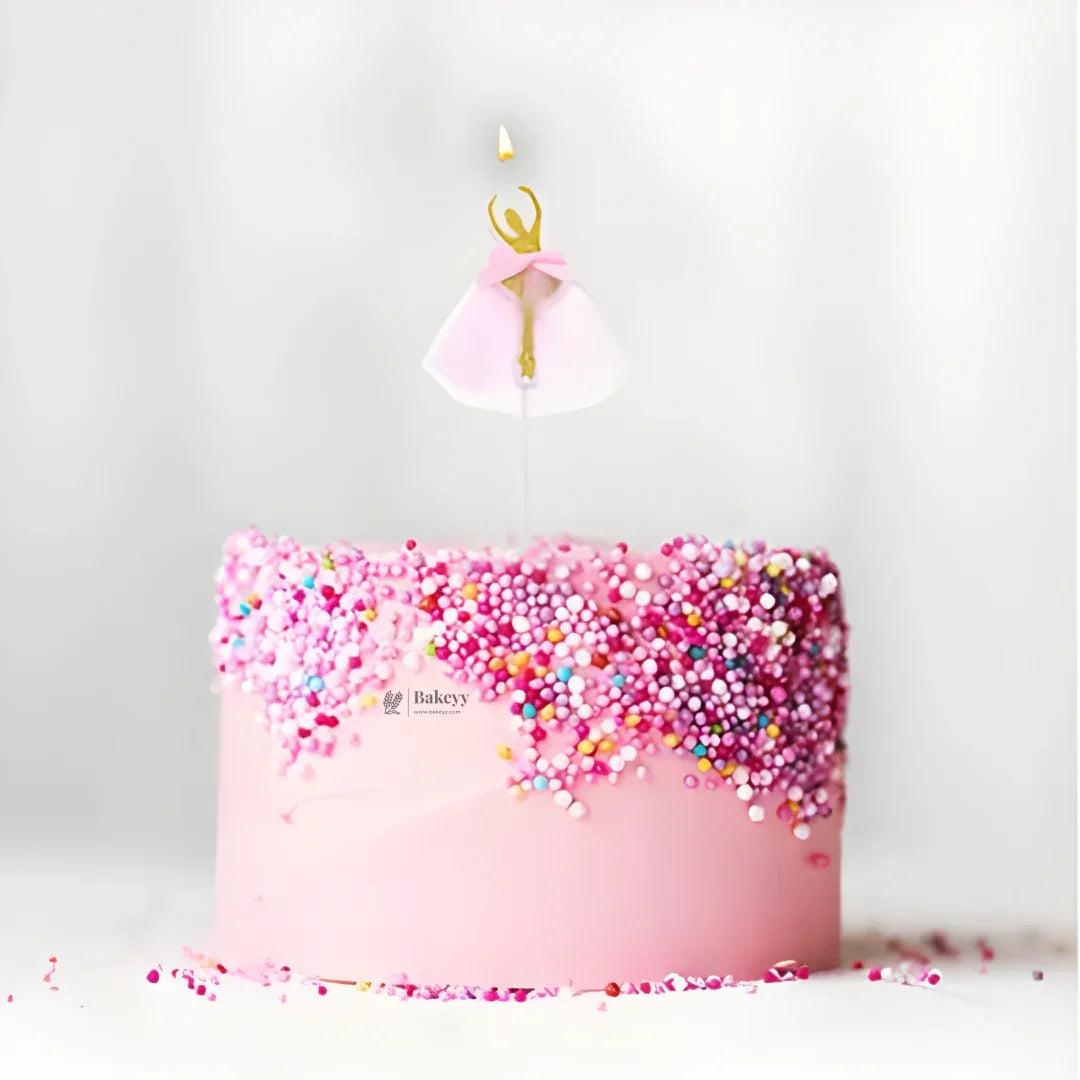 Pink sprinkle cake with ballerina candle topper from Bakeyy, wholesale baking supplies India