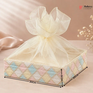 Decorative gift box with a sheer bow on a soft pink background, featuring dimensions.