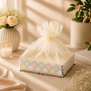 Decorative box with a bow on a table with flowers and candles