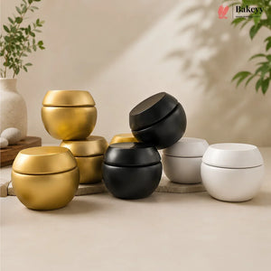 Three metallic containers in gold, black, and white on a neutral background with 'Bakeey' branding.