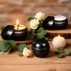 Black jars and candles on a wooden surface with flowers and greenery, featuring the Bakey brand.