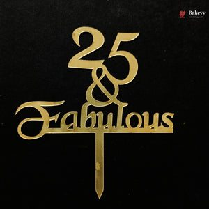 Gold metallic cake topper with the text '25 & Fabulous' on a black background, featuring a small Bakeey logo in the top right corner.