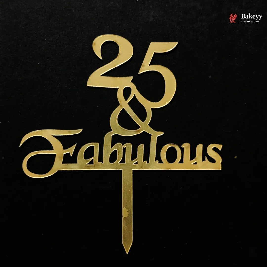 Gold metallic cake topper with the text '25 & Fabulous' on a black background, featuring a small Bakeey logo in the top right corner.