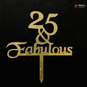 Gold metallic cake topper with the text '25 & Fabulous' on a black background, featuring a small Bakeey logo in the top right corner.