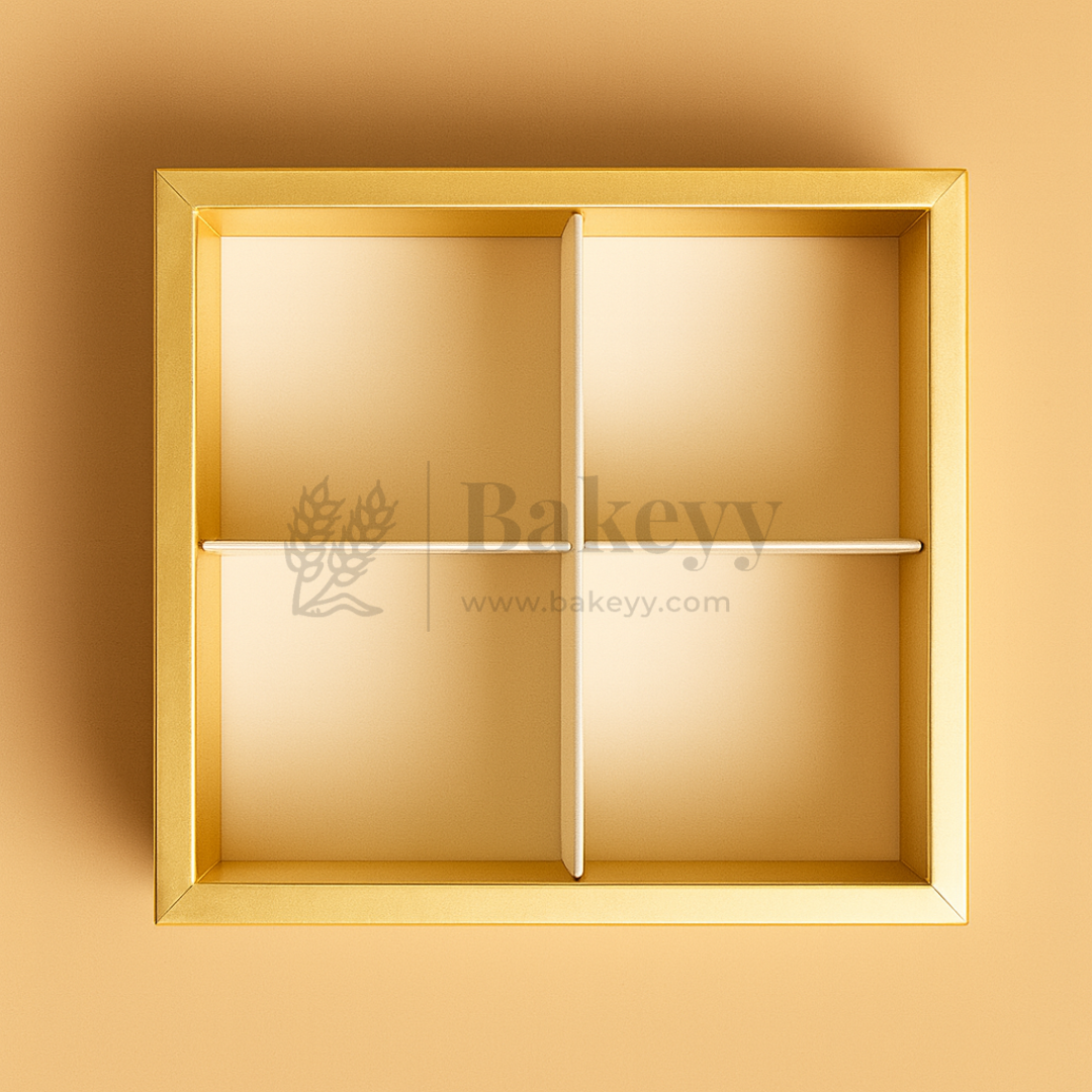 Gold rectangular box with a divided interior on a beige background, featuring the brand 'Bakeryy'.
