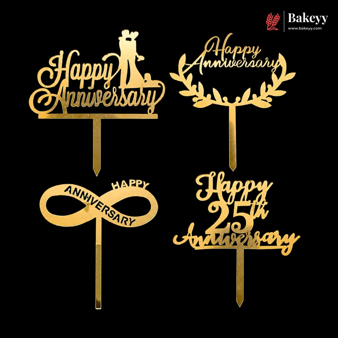 Four gold anniversary cake toppers on a black background, including Happy Anniversary, Happy Anniversary with wreath, Happy Anniversary with infinity symbol, and Happy 25th Anniversary.