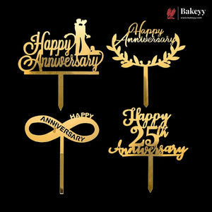 Four gold anniversary cake toppers on a black background, including Happy Anniversary, Happy Anniversary with wreath, Happy Anniversary with infinity symbol, and Happy 25th Anniversary.