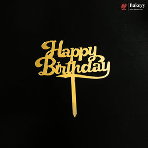 Gold acrylic 'Happy Birthday' cake topper with a stem, displayed on a solid black background. A Bakeey brand logo is visible in the top right corner.
