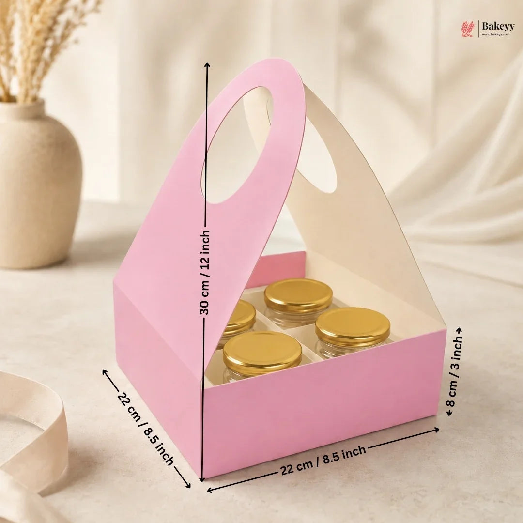 Pink gift box with gold items and measurements on a beige background