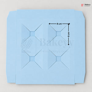 Blue baking paper with grid lines and measurements on a light gray background