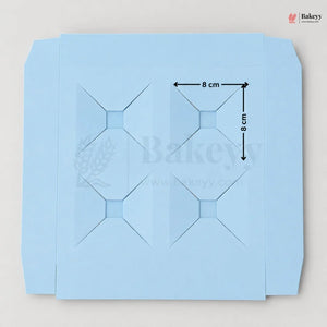 Blue baking paper with grid lines and measurements on a light gray background