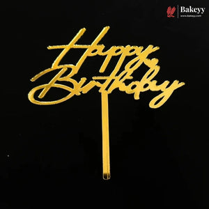 Gold metallic 'Happy Birthday' script cake topper on a black background, with a Bakeey brand logo in the top right corner.