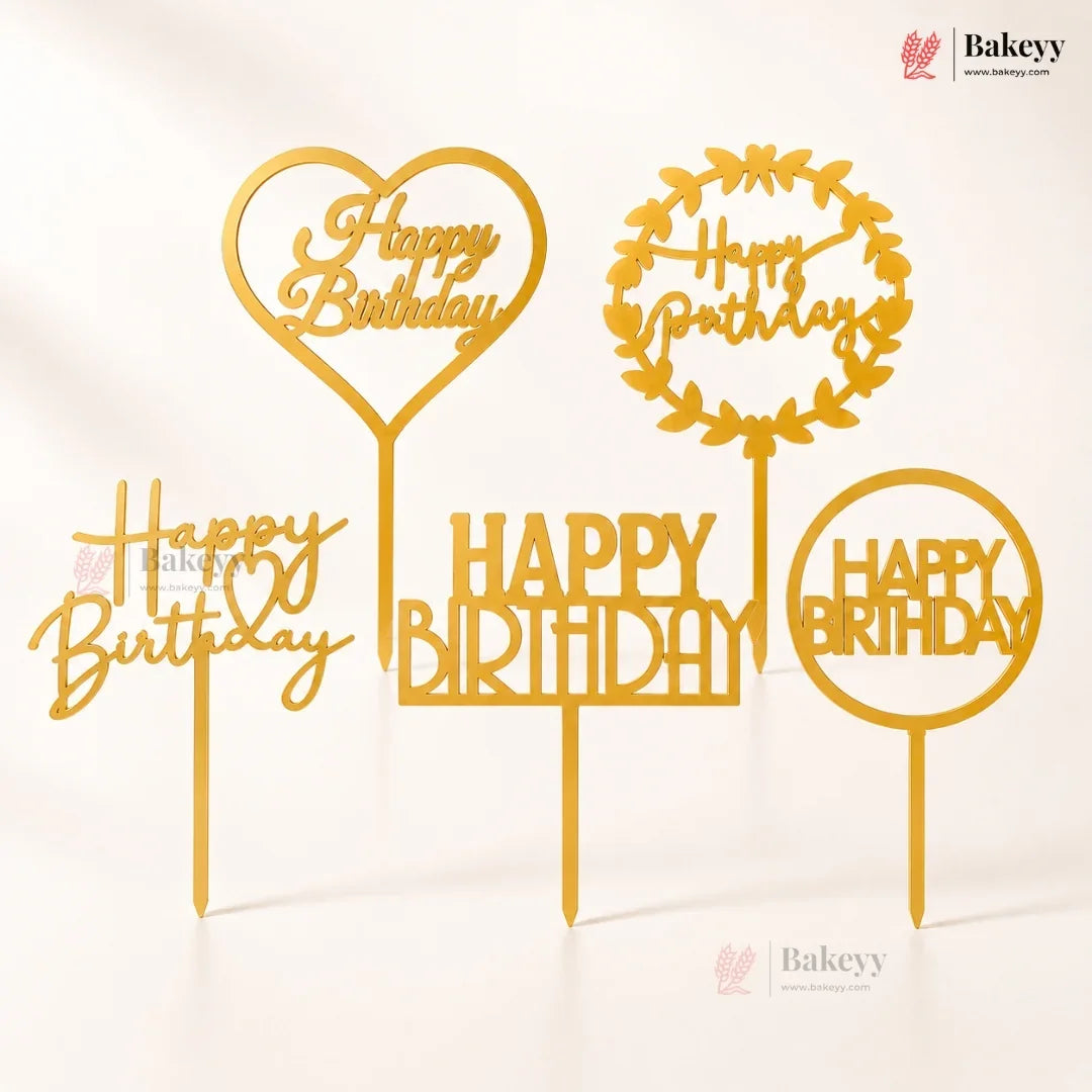 Gold 'Happy Birthday' cake toppers with different designs on a white background, featuring the Bakeyy brand.