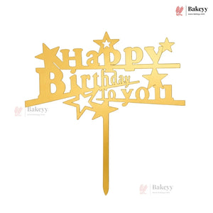Gold 'Happy Birthday to you' cake topper with star designs on a white background
